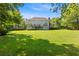 The expansive backyard view shows a beautifully maintained lawn, perfect for outdoor activities at 8030 Eagle Lake Vw, Cumming, GA 30028