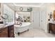 Bright bathroom featuring a claw foot tub, and ample storage at 8030 Eagle Lake Vw, Cumming, GA 30028