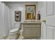 Cozy bathroom featuring a tiled vanity, mirror, and shower with neutral tones and a clean design at 8030 Eagle Lake Vw, Cumming, GA 30028