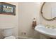 Bathroom featuring a pedestal sink with gold-tone fixtures at 8030 Eagle Lake Vw, Cumming, GA 30028