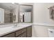 Bright bathroom with gray cabinets, updated vanity and white tile floors at 8030 Eagle Lake Vw, Cumming, GA 30028