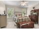Bright bedroom featuring carpet floors, windows that provide ample natural light, and a chest at 8030 Eagle Lake Vw, Cumming, GA 30028