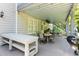 Cozy covered patio featuring a dining area and grill, ideal for outdoor gatherings and barbecues at 8030 Eagle Lake Vw, Cumming, GA 30028