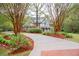 Beautiful two-story home with manicured lawn, mature trees, and long private driveway at 8030 Eagle Lake Vw, Cumming, GA 30028