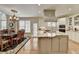 Spacious kitchen featuring granite counters, a large island, stainless appliances and an eat in dining area at 8030 Eagle Lake Vw, Cumming, GA 30028