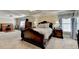 Large main bedroom boasts a tray ceiling and ample natural light at 8030 Eagle Lake Vw, Cumming, GA 30028