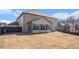 Backyard with ample space, including a view of the screened-in porch at 975 Matt Springs Ct, Lawrenceville, GA 30045