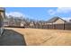 Large, level backyard with a wood fence, perfect for outdoor activities at 975 Matt Springs Ct, Lawrenceville, GA 30045