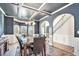 Formal dining room with coffered ceiling and elegant decor at 975 Matt Springs Ct, Lawrenceville, GA 30045