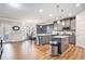 Bright kitchen featuring gray cabinets, granite countertops, and stainless steel appliances at 975 Matt Springs Ct, Lawrenceville, GA 30045