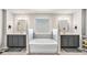 Bright main bathroom with double vanities and a large soaking tub at 975 Matt Springs Ct, Lawrenceville, GA 30045