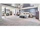 Spacious main bedroom suite featuring a sitting area, fireplace, and tray ceiling at 975 Matt Springs Ct, Lawrenceville, GA 30045