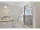 Bathroom with a double sink vanity, glass shower and stand alone tub at 12495 Concord Hall Dr, Alpharetta, GA 30005
