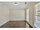 Bedroom with hardwood floors and a neutral color scheme, offering a serene and inviting space at 12495 Concord Hall Dr, Alpharetta, GA 30005