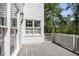 Deck overlooking the backyard, providing outdoor living space with a white railing at 12495 Concord Hall Dr, Alpharetta, GA 30005