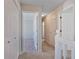 Upstairs hallway features neutral carpet and white doors leading into the bedrooms at 12495 Concord Hall Dr, Alpharetta, GA 30005