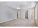 Large main bedroom featuring neutral walls and carpet plus a view into bathroom and closet at 12495 Concord Hall Dr, Alpharetta, GA 30005