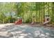 A closer view of the community playground, showing various climbing and sliding structures at 12495 Concord Hall Dr, Alpharetta, GA 30005