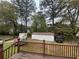 View from the deck showing backyard, shed, fencing, and natural surrounding at 1727 Walt Stephens Rd, Jonesboro, GA 30236