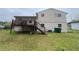 Backyard view showing multi-level deck and well maintained yard at 1727 Walt Stephens Rd, Jonesboro, GA 30236