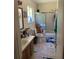 Bathroom with tile flooring, shower and tub combo, and natural light from the window at 1727 Walt Stephens Rd, Jonesboro, GA 30236