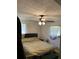 Bedroom with a ceiling fan and windows on either side of the bed at 1727 Walt Stephens Rd, Jonesboro, GA 30236