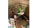 Interior of outdoor shed with abundant storage and natural light through the doorway at 1727 Walt Stephens Rd, Jonesboro, GA 30236