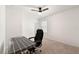 Carpeted bedroom featuring a ceiling fan, a window, and neutral walls at 3848 Hester St, Duluth, GA 30097