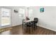 Cozy dining area with a table and chairs near a door with natural light at 3848 Hester St, Duluth, GA 30097