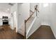 Inviting foyer with a staircase leading upstairs and wood-look flooring at 3848 Hester St, Duluth, GA 30097