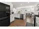 Modern kitchen with stainless steel appliances, a center island and a black fridge at 3848 Hester St, Duluth, GA 30097