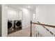 Convenient upper level laundry room featuring updated washer and dryer machines and extra storage space at 3848 Hester St, Duluth, GA 30097