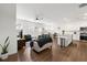 Spacious living room and kitchen area with hardwood floors and lots of natural light at 3848 Hester St, Duluth, GA 30097