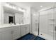 Bright main bathroom with double vanity, glass shower and modern fixtures at 3848 Hester St, Duluth, GA 30097