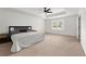 Spacious main bedroom with carpet, tray ceiling and abundant natural light at 3848 Hester St, Duluth, GA 30097