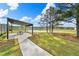 Inviting outdoor picnic area with a shade structure and scenic pond views at 3848 Hester St, Duluth, GA 30097