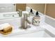 Close-up of bathroom sink highlighting the faucet, counter, and decorative soap dispenser at 5885 Waggoner Cv, Rex, GA 30273