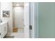 Bathroom features tile floors, white cabinets, a framed mirror, and a toilet at 5885 Waggoner Cv, Rex, GA 30273
