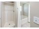 Bathroom with shower and bathtub combination featuring white tile and a shower curtain at 5885 Waggoner Cv, Rex, GA 30273