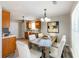 Bright kitchen and dining area with stainless steel appliances and light-colored walls and natural light at 5885 Waggoner Cv, Rex, GA 30273