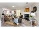 Bright living room features stylish decor, a fireplace, and an open layout to the dining area at 5885 Waggoner Cv, Rex, GA 30273