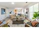 Inviting living room with a comfortable seating arrangement, modern flooring, and ample natural light at 5885 Waggoner Cv, Rex, GA 30273