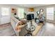 Comfortable living room with a fireplace, neutral tones, and a view of the outdoor scenery at 5885 Waggoner Cv, Rex, GA 30273