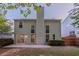 Spacious backyard featuring an outdoor patio and a view of the home's rear exterior at 2545 Davenport Park Dr, Duluth, GA 30096