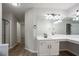 Modern bathroom featuring dual sinks, quartz counters, and contemporary lighting at 2545 Davenport Park Dr, Duluth, GA 30096