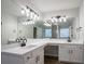 Modern bathroom featuring dual sinks, quartz counters, and contemporary lighting at 2545 Davenport Park Dr, Duluth, GA 30096
