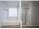 Bright bathroom with a soaking tub, separate shower, and contemporary finishes at 2545 Davenport Park Dr, Duluth, GA 30096