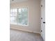 Neutral bedroom featuring modern trim and a large window at 2545 Davenport Park Dr, Duluth, GA 30096
