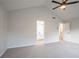 Vaulted bedroom with plush carpet that transitions to a modern bathroom at 2545 Davenport Park Dr, Duluth, GA 30096