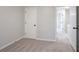 Comfortable bedroom featuring neutral carpet, a built-in closet, and doorways at 2545 Davenport Park Dr, Duluth, GA 30096